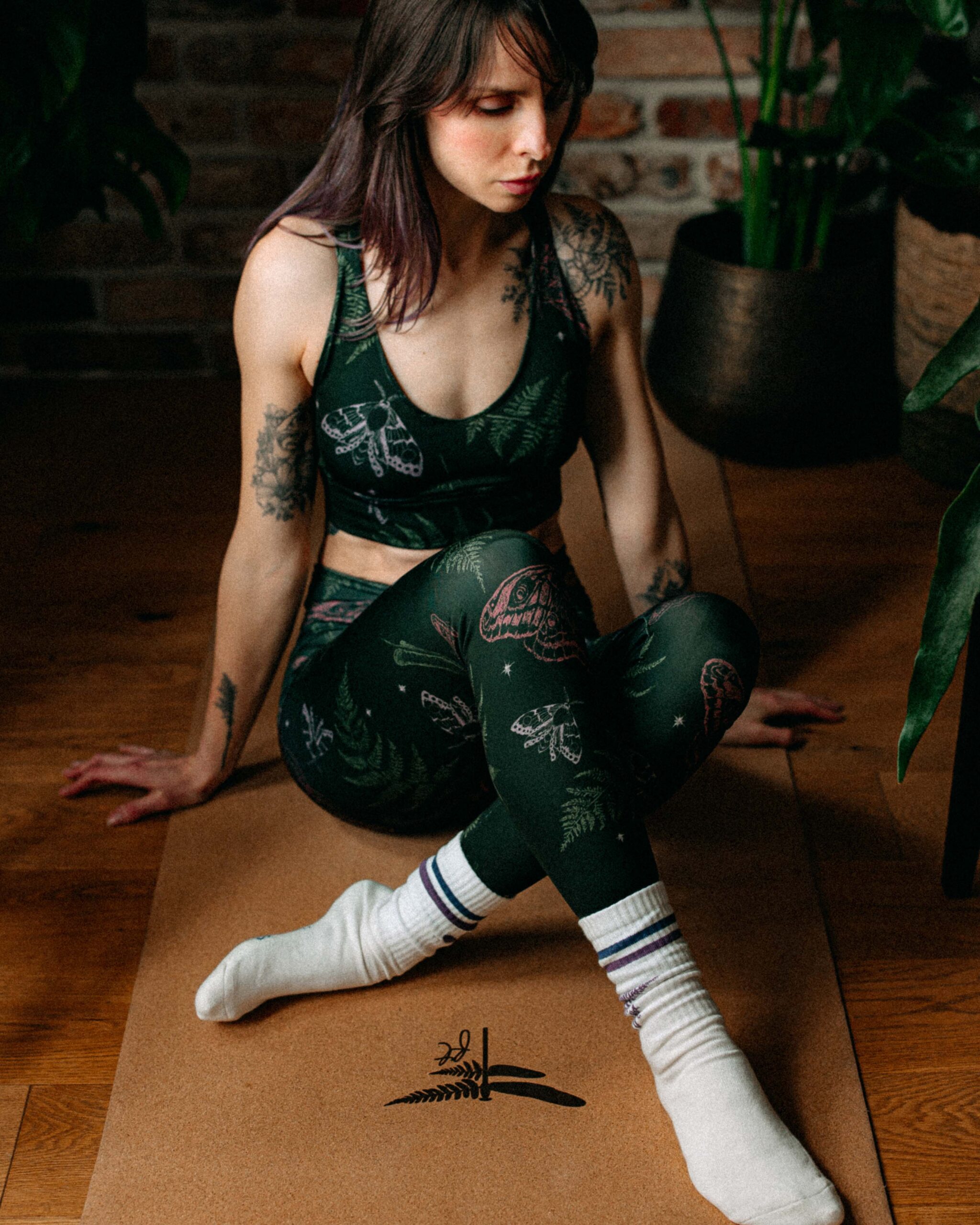 Full outfit shot of the Midnight Stories Sport Top paired with leggings.
