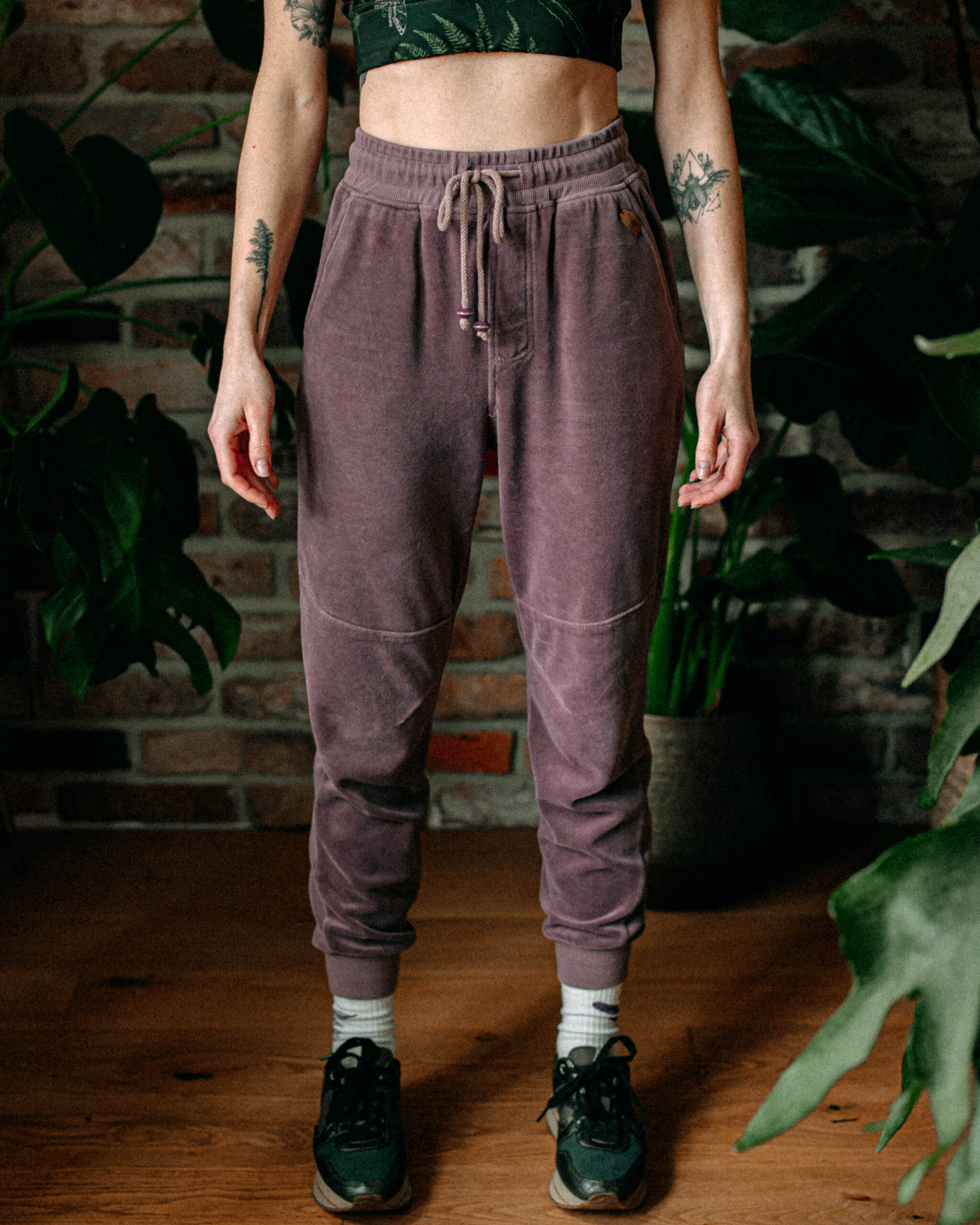 Model standing in full view wearing Moorlands Velvet Joggers.